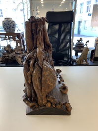 A Chinese carved wooden group and a natural root sculpture, 20th C.
