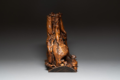 A Chinese carved wooden group and a natural root sculpture, 20th C.