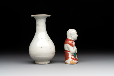 Two Chinese Dehua blanc de Chine Buddha and Wenchang figures, a seal paste covered box, a vase and an iron-red-glazed boy, Qianlong mark, 19/20th C.