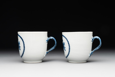 A pair of Chinese blue and white handled cups and saucers and a milk jug, Qianlong/Jiaqing
