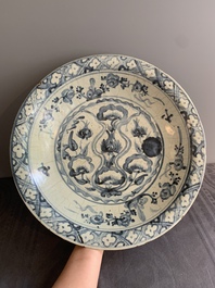 A Chinese Swatow blue and white dish with stylised floral design, Ming