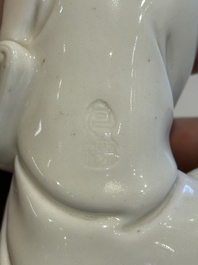 Two Chinese Dehua blanc de Chine figures of Guanyin and Shoulao and a pair of Buddhist lions, He Chaozong 何朝宗 mark, 18/19th C.