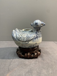 A Chinese blue and white 'double mandarin duck' ewer or water dropper on wooden stand, Ming, ca. 1500