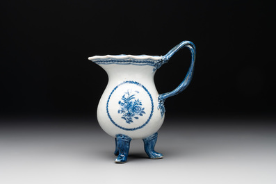A pair of Chinese blue and white handled cups and saucers and a milk jug, Qianlong/Jiaqing