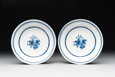 A pair of Chinese blue and white handled cups and saucers and a milk jug, Qianlong/Jiaqing