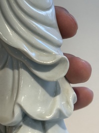 Two Chinese Dehua blanc de Chine figures of Guanyin and Shoulao and a pair of Buddhist lions, He Chaozong 何朝宗 mark, 18/19th C.