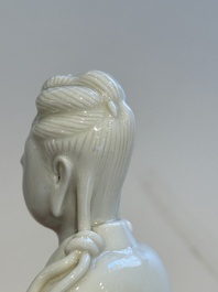 Two Chinese Dehua blanc de Chine figures of Guanyin and Shoulao and a pair of Buddhist lions, He Chaozong 何朝宗 mark, 18/19th C.
