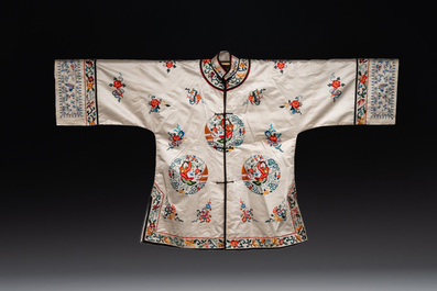 Two Chinese embroidered silk women's robes, 20th C.