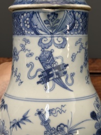 Two Chinese blue and white jugs and cover with floral design, Yongzheng/Qianlong