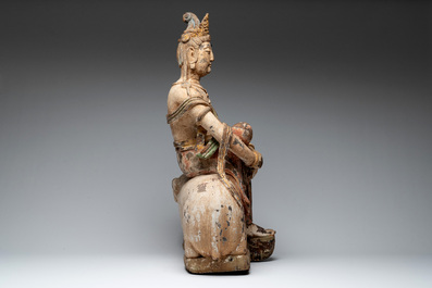 A large Chinese polychromed wooden Guanyin seated on an elephant, Republic