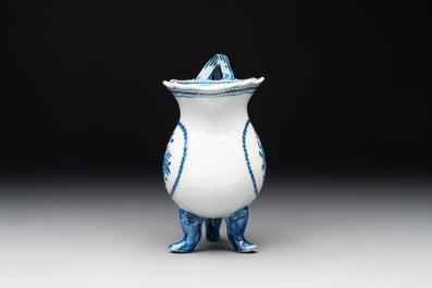 A pair of Chinese blue and white handled cups and saucers and a milk jug, Qianlong/Jiaqing