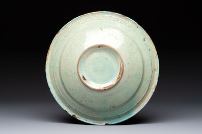 A polychrome maiolica dish and two blue and white dishes, Northern Netherlands, 17/18th C.