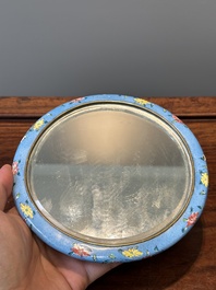 A Chinese Canton enamel blue-ground circular hand mirror, early 19th C.