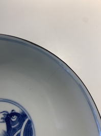 A Chinese blue and white 'Bleu de Hue' 'roosters and chick' plaque in a carved wooden screen and a bowl, 19th C.