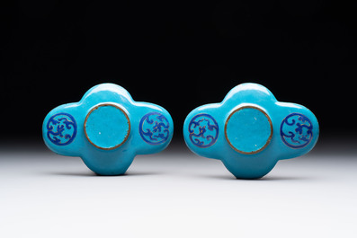 A pair of Chinese blue-ground Canton enamel covered bowls on stands and an egg cup, Qianlong/Jiaqing