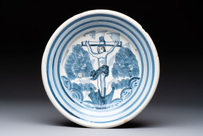 A polychrome maiolica dish and two blue and white dishes, Northern Netherlands, 17/18th C.