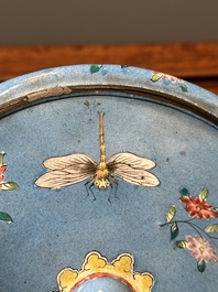 A Chinese Canton enamel blue-ground circular hand mirror, early 19th C.