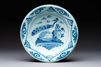 A polychrome maiolica dish and two blue and white dishes, Northern Netherlands, 17/18th C.