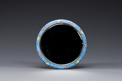 A Chinese Canton enamel blue-ground circular hand mirror, early 19th C.
