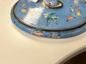 A Chinese Canton enamel blue-ground circular hand mirror, early 19th C.