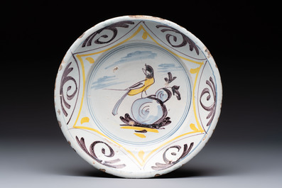 A polychrome maiolica dish and two blue and white dishes, Northern Netherlands, 17/18th C.