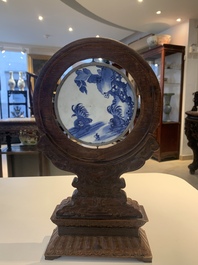 A Chinese blue and white 'Bleu de Hue' 'roosters and chick' plaque in a carved wooden screen and a bowl, 19th C.