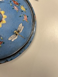 A Chinese Canton enamel blue-ground circular hand mirror, early 19th C.
