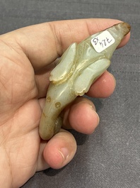 Three Chinese celadon and russet jade carvings of animals, 19th C.