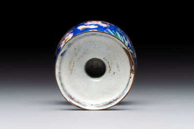 A pair of Chinese blue-ground Canton enamel covered bowls on stands and an egg cup, Qianlong/Jiaqing