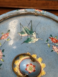 A Chinese Canton enamel blue-ground circular hand mirror, early 19th C.