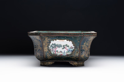 A Chinese Canton enamel gilt-decorated dark-green-ground jardini&egrave;re with four inserted plaques, Qianlong/Jiaqing