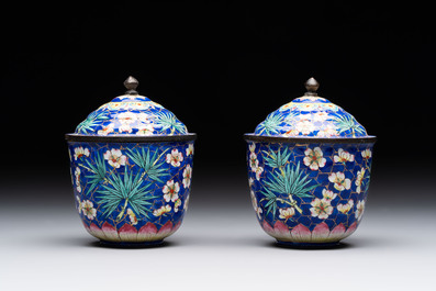 A pair of Chinese blue-ground Canton enamel covered bowls on stands and an egg cup, Qianlong/Jiaqing