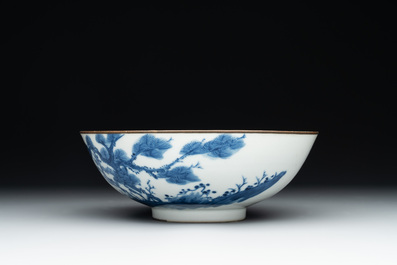 A Chinese blue and white 'Bleu de Hue' 'roosters and chick' plaque in a carved wooden screen and a bowl, 19th C.