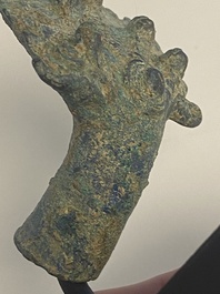Three bronze Khmer palanquin hooks, a bell and a dagger, Angkor Wat periode, Thailand, 12th C.