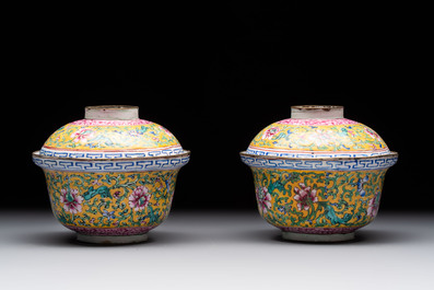 A pair of Chinese yellow-ground Canton enamel covered bowls and two cups, Yongzheng/Qianlong