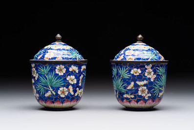 A pair of Chinese blue-ground Canton enamel covered bowls on stands and an egg cup, Qianlong/Jiaqing