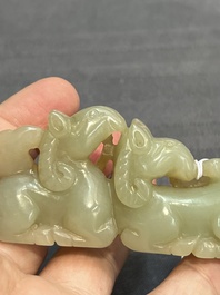 Three Chinese celadon and russet jade carvings of animals, 19th C.
