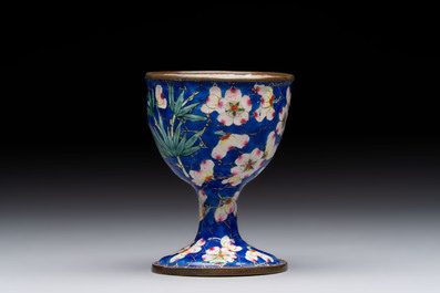 A pair of Chinese blue-ground Canton enamel covered bowls on stands and an egg cup, Qianlong/Jiaqing