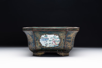 A Chinese Canton enamel gilt-decorated dark-green-ground jardini&egrave;re with four inserted plaques, Qianlong/Jiaqing