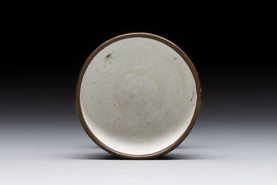 A pair of Chinese blue-ground Canton enamel covered bowls on stands and an egg cup, Qianlong/Jiaqing
