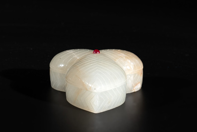 A Chinese Mughal-style leaf-shaped ruby-inset jade box and cover on wooden base, 18th C.
