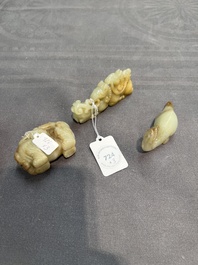 Three Chinese celadon and russet jade carvings of animals, 19th C.
