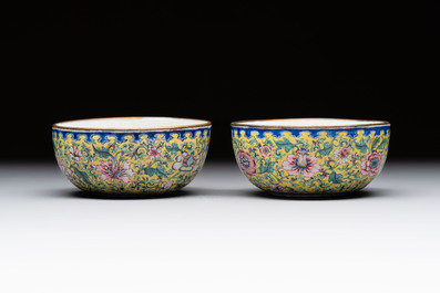 A pair of Chinese yellow-ground Canton enamel covered bowls and two cups, Yongzheng/Qianlong