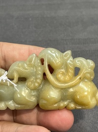 Three Chinese celadon and russet jade carvings of animals, 19th C.