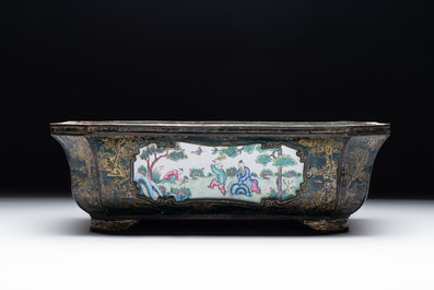 A Chinese Canton enamel gilt-decorated dark-green-ground jardini&egrave;re with four inserted plaques, Qianlong/Jiaqing