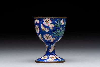 A pair of Chinese blue-ground Canton enamel covered bowls on stands and an egg cup, Qianlong/Jiaqing