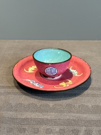 A rare Chinese Canton enamel ruby-ground 'Bats and Shou' cup on stand, Qianlong mark and of the period