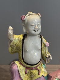 A Chinese famille rose 'Hehe Erxian' group on a wooden stand, Qianlong