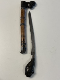 A collection of six krises with carved handles, four with scabbard, Indonesia, 19th C.