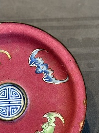 A rare Chinese Canton enamel ruby-ground 'Bats and Shou' cup on stand, Qianlong mark and of the period